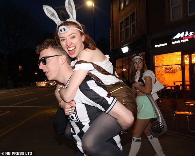 Revelers in Leeds in football strips, donkey costumes and dressed as golfers on Saturday