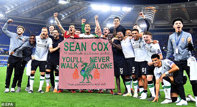 Liverpool players displayed a banner in support of Cox after he was attacked in 2018