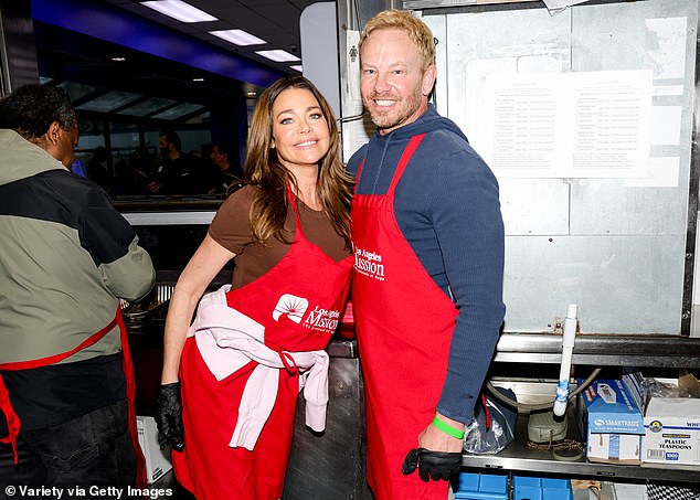 Richards and Ian Ziering in the kitchen wearing their red aprons