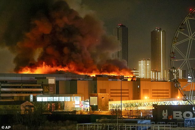 On Friday, March 22, 2024, a massive fire can be seen above the Crocus City Hall on the western outskirts of Moscow, Russia.  Several armed men stormed into a major concert hall in Moscow and fired automatic weapons into the crowd, injuring hundreds of people and igniting a major fire.  a huge fire