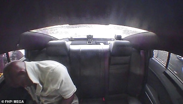 Dashcam footage shows the 34-year-old sleeping in his seat in the back of a police car