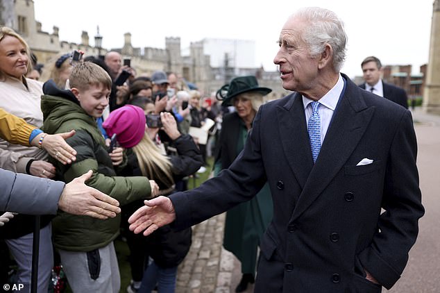 Charles was in good spirits as he shook hands with dozens of people at St George's Chapel