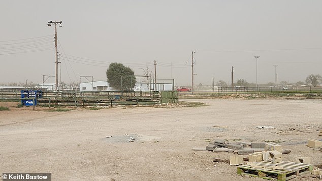 Another photo showed dust taking over a baseball field with the same dark sky in the background