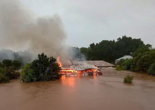 A house in Lismore, northern NSW, was engulfed by flames while underwater in 2022