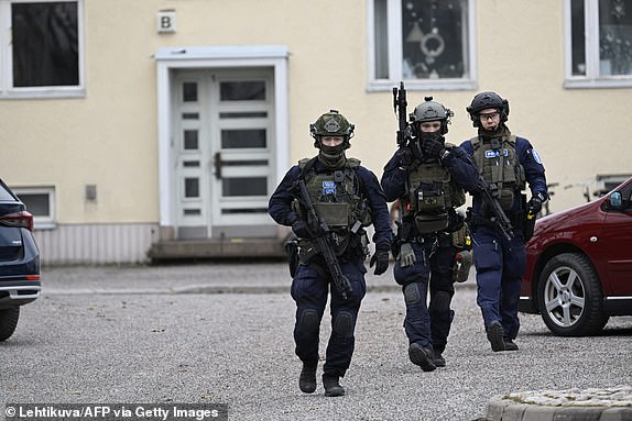 Finnish police investigate the scene at Viertola primary school where a child opened fire and injured three other children on April 2, 2024 in Vantaa, outside the Finnish capital Helsinki.  Police said the attacker was in custody, and 