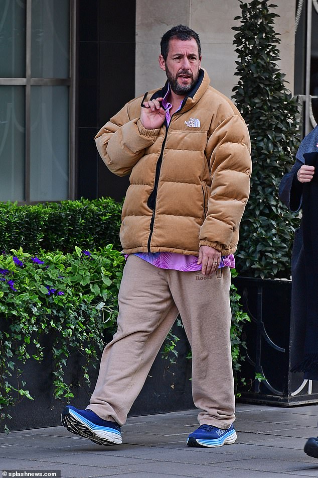 The Happy Gilmore actor, 57, donned a mustard yellow North Face jacket, paired with beige joggers and blue sneakers