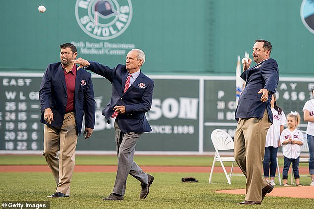 Lucchino (center) throws a first pitch during a Red Sox Hall of Fame ceremony in 2016