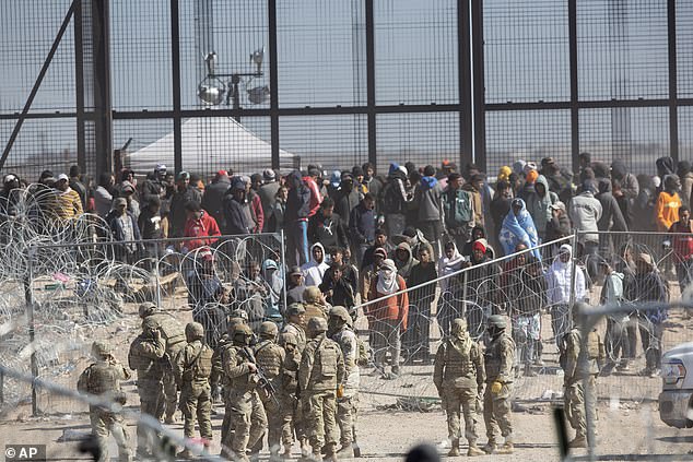 Migrants breaking barriers in El Paso, Texas on March 21, 2024