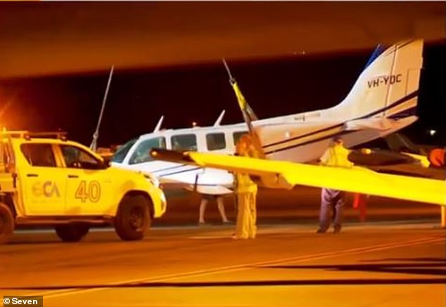 Emergency services, including critical care paramedics, were stationed on the tarmac in the event of a failed landing (pictured).  Both pilots walked away from the ordeal without a scratch