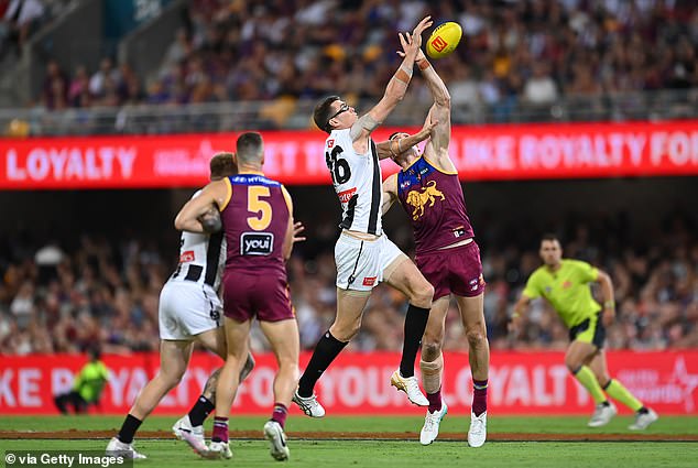 Collingwood then responded by beating Brisbane at the Gabba in a grand final replay, earning their first win of 2024 (Pies ruckman Mason Cox is pictured, centre)