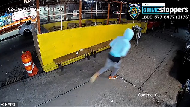 The suspect remains at large, despite the NYPD releasing photos of his face and surveillance footage of him running away in a light blue puffer jacket.