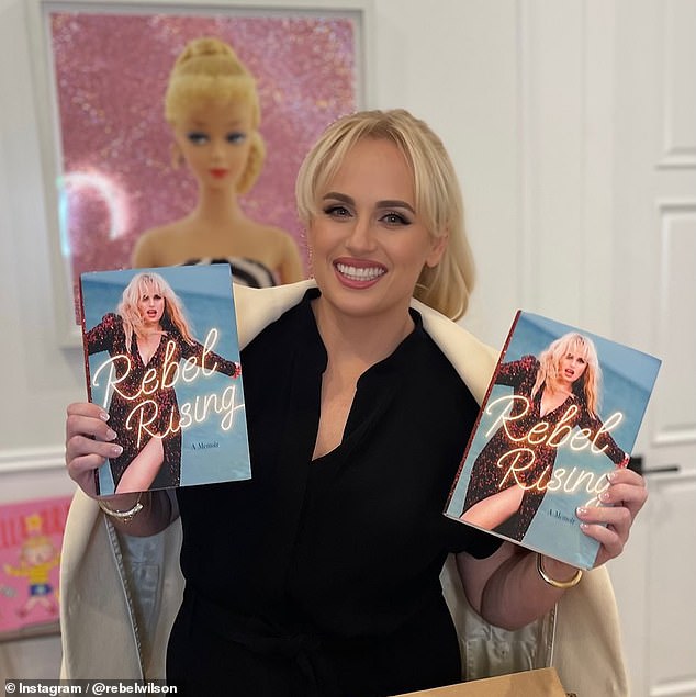 Rebel has been pictured with her book, claiming Sacha would ask her on set to undress for scenes despite her 'no nudity' rule - claims Sacha has strenuously denied