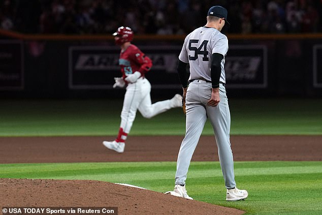 D'Backs first baseman Christian Walker runs the bases after hitting a three-run home run against Yankees relief pitcher Jake Cousins