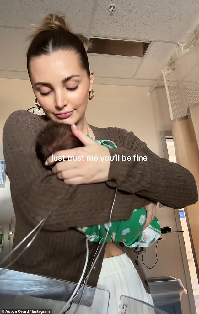 The video jumped to the influencer gently cradling her newborn while still in the hospital, writing, 