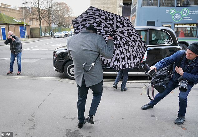 Guccuk (pictured, leaving Oxford Magistrates' Court in November) is charged with conspiracy to transfer criminal property, as is