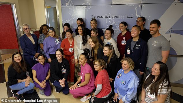 Meghan poses for a group photo during her visit to Children's Hospital Los Angeles last month