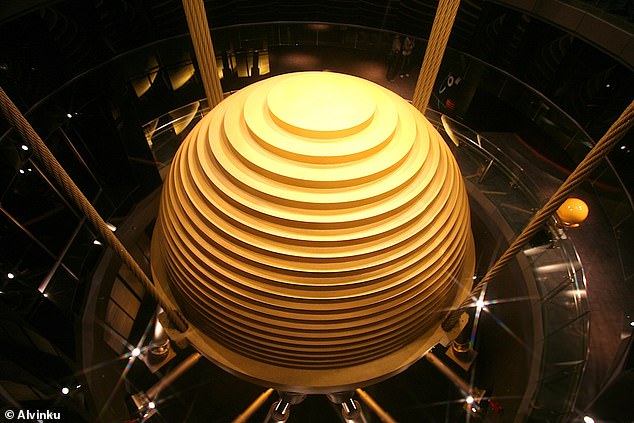 The key to the building's astonishing structural integrity is a 660-ton golden sphere hanging from the 92nd floor – the 'tuned mass damper'