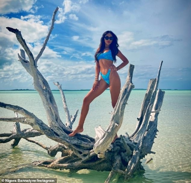 Indeed, the brunette proved age is just a number as she showed off her washboard abs in a spotted blue bikini as she posed for a series of seaside snaps.