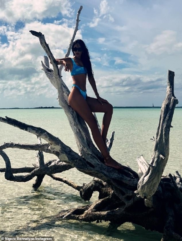 In one image, shared with her 29,000 Instagram followers, she leans back against a tangled piece of sun-bleached driftwood