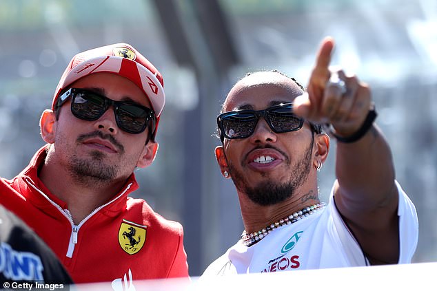 Hamilton will partner Charles Leclerc (left) at Ferrari next season after signing a two-year contract