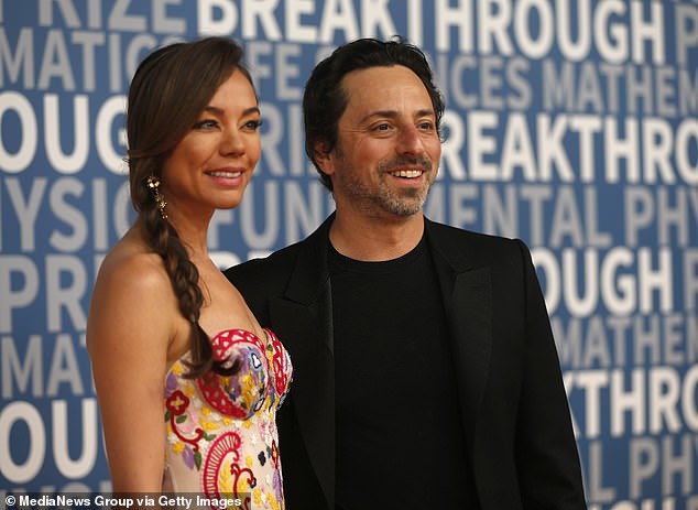 Nicole Shanahan (left) poses with her second husband Sergey Brin (right), the billionaire and co-founder of Google, at an event in 2016 while they were dating