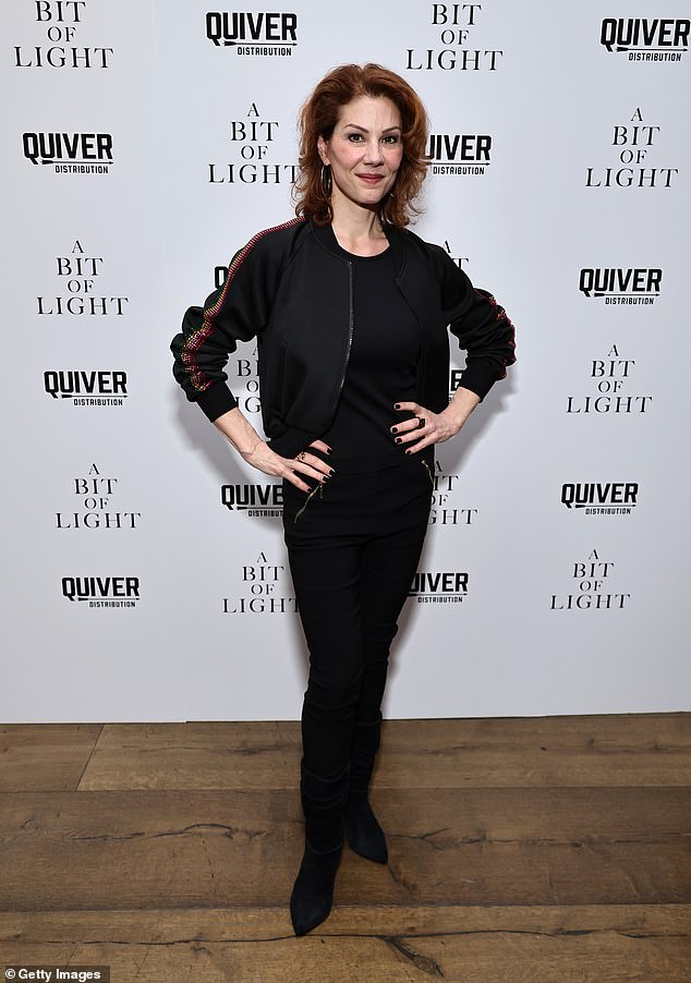 Stephanie Kurtzuba, a breakout supporting actress in Martin Scorsese's modern classic The Wolf Of Wall Street, looked relaxed in a casual black jacket with rainbow sequins on the sleeves.  She wore it with a casual black top and pants, and with black suede boots