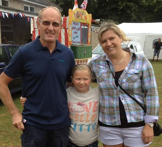 Katie (center) with her stepfather Peter William Goodchild (left) and Katie's mother, Sarah (right)