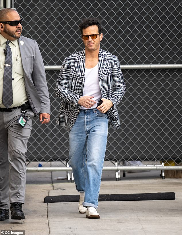 Andrew added white loafers and rocked retro maroon shades