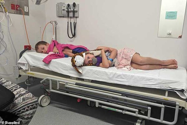 Max and his friend Cassie are pictured on a hospital cart while being treated for margarita burns