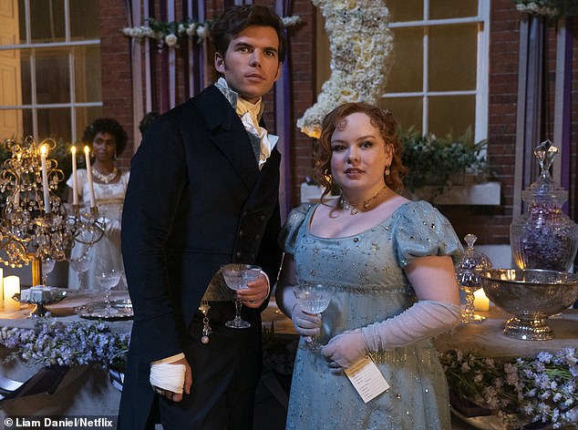 Nicola recently revealed that series three of Bridgerton will be even grittier than the previous two (pictured with love interest Colin Bridgerton, played by Luke Newton)