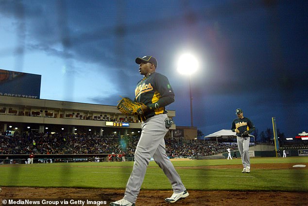 Yoenis Cespedes (52) walks back to the dugout during the 2012 exhibition in Sacramento