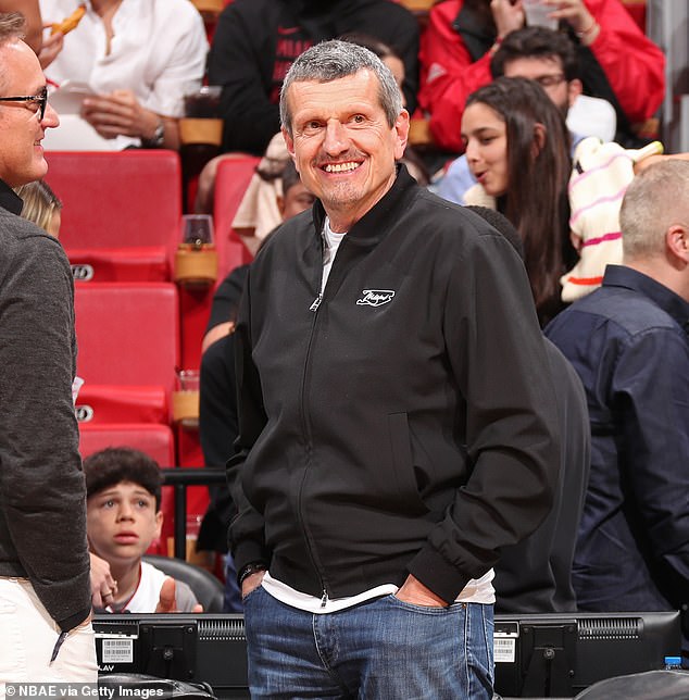 Former Haas boss Steiner smiles as he sits on the right, wearing his black Miami GP jersey