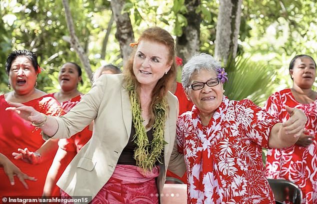 Dressed in a green garland, the royal family meets more islanders during its trip to Samoa