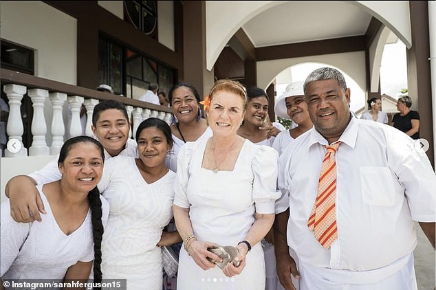 Dressed in white, the Duchess appears delighted as she is photographed meeting more locals from Samoa