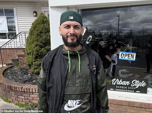 Urban Style Barbershop Steven is the one featured in the now viral images.  He is pictured here outside his shop in Bedminster, NJ