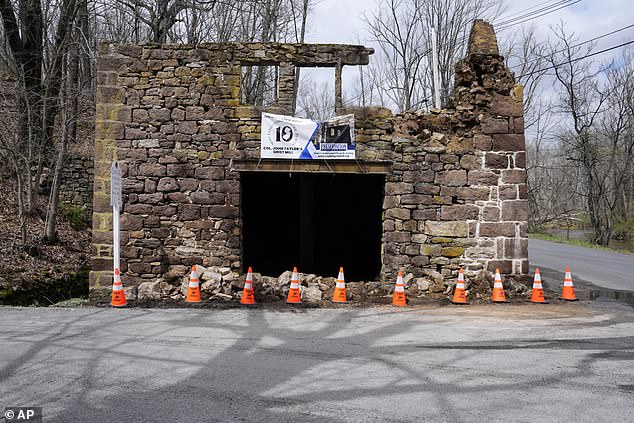 Cones seal fallen debris from the historic Taylor's Mill in Lebanon, NJ, Friday.  The US Geological Survey reported an earthquake with a preliminary magnitude of 4.8 at 10:23 a.m., centered near Whitehouse Station, 45 miles west of New York City and 50 miles north of Philly.