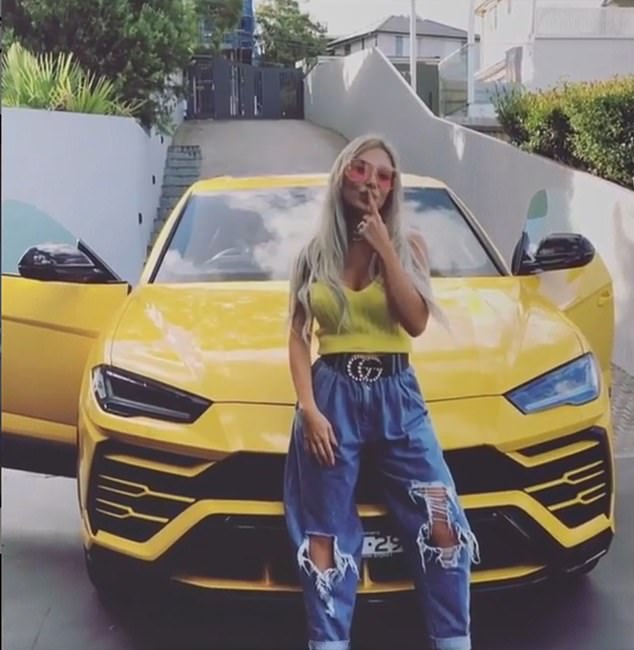 Mr Nassif's former wife Nissy poses in front of the infamous yellow Lamborghini given to her by the developer in a TikTok that spawned a thousand imitations and parodies