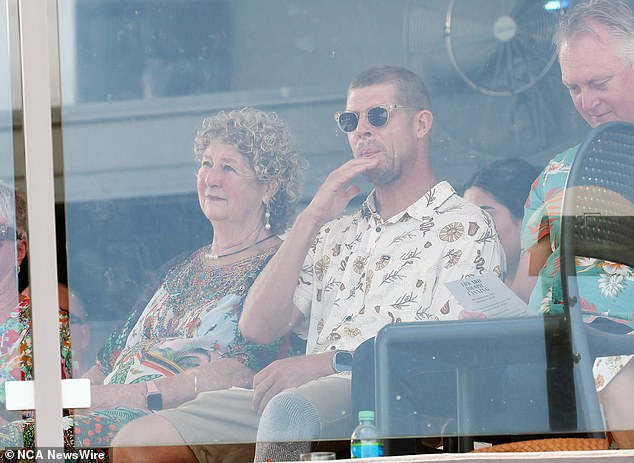 Mick Fanning (centre) is pictured with his mother Liz Osborne (left) at a memorial service for Ed Fanning