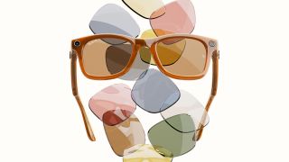 Orange RayBan Meta Smart glasses in front of a wall with colorful lenses including green, blue, yellow and pink