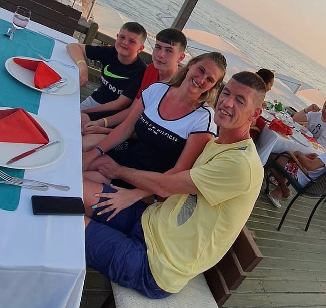 Mr Downey, pictured with his partner Ms Scott and two sons Lucas Downey, 19, and Taylor Downey 12, says he is 'too strong and too healthy to even dream of giving up'