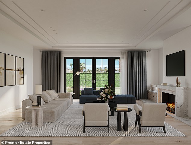 The three-story residence sits on approximately half an acre of land and offers beautiful ocean views and private beach access.  In the photo: another living room