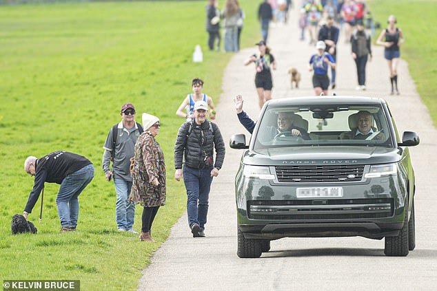 Good boy!  The dog is safely put on the side of the road and the duke waves cheerfully