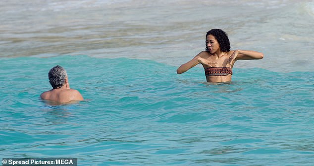 The pair enjoyed a dip in the turquoise water