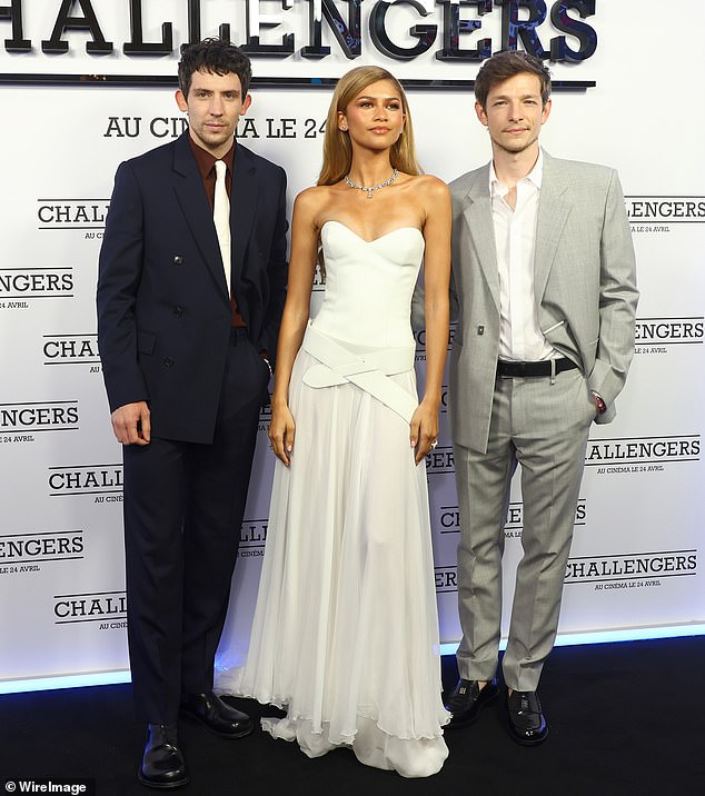 She oozed confidence as she posed up a storm before being joined by co-stars Josh O'Connor (L) and Mike Faist (R)