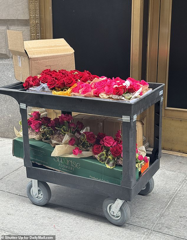 Boxes of pink and red roses were seen arriving at the reception