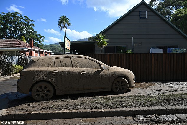 The heavy downpour has caused a mess on the street and everything in it (photo: a car in Wollongong)