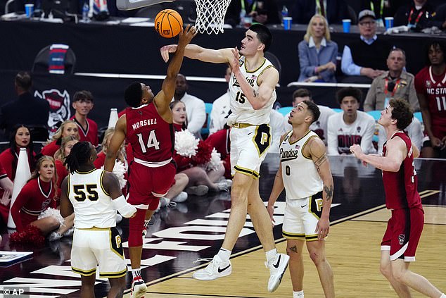 Edey (15) blocks NC State guard Casey Morsell's shot in the second half