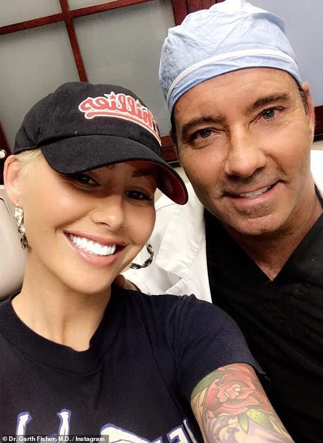 Dr.  Fisher is pictured with Amber Rose, on whom he performed a breast reduction