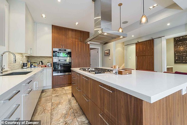 A city report made it clear that the house's landmark status stemmed from its architectural significance, not its ownership history (photo: the house's newly renovated kitchen)