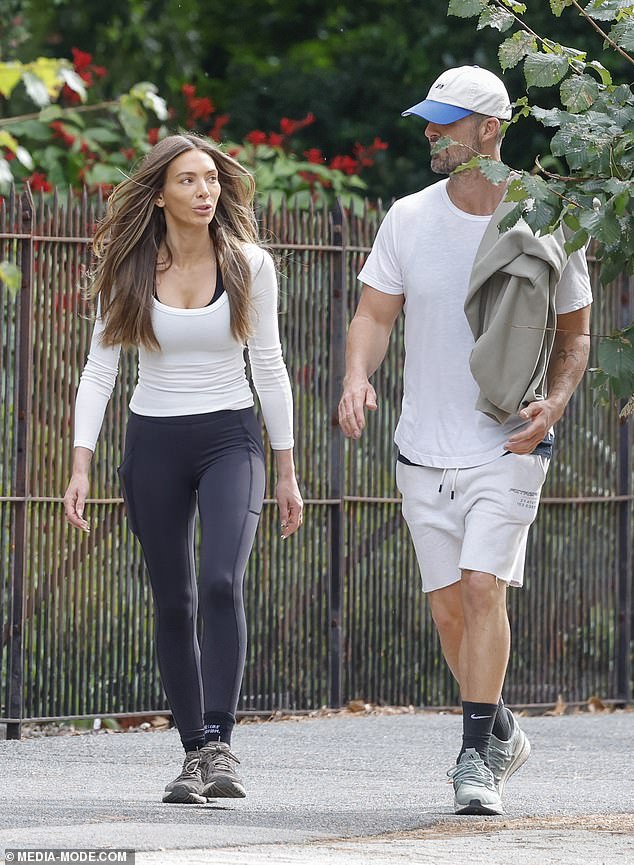 Peter, meanwhile, dressed for comfort in a white T-shirt, matching shorts, black Nike socks and green sneakers